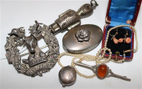 An early 20th century silver Gordon Highlanders Bydand badge and other sundry items.
